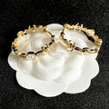 CHANEL 26S DOUBLE C LOGO WHITE ENAMEL & CRYSTAL LINK HOOP EARRINGS IN GOLD METAL 629898