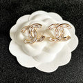 CHANEL 26S DOUBLE C LOGO WHITE ENAMEL STUD EARRINGS IN GOLD METAL 629903