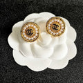 CHANEL 26S DOUBLE C LOGO PEARL ROUND STUD EARRINGS IN GOLD METAL 629906