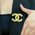 CHANEL 26S CHANEL DOUBLE C LOGO YELLOW & PINK ENAMEL BROOCH IN SILVER METAL 629912
