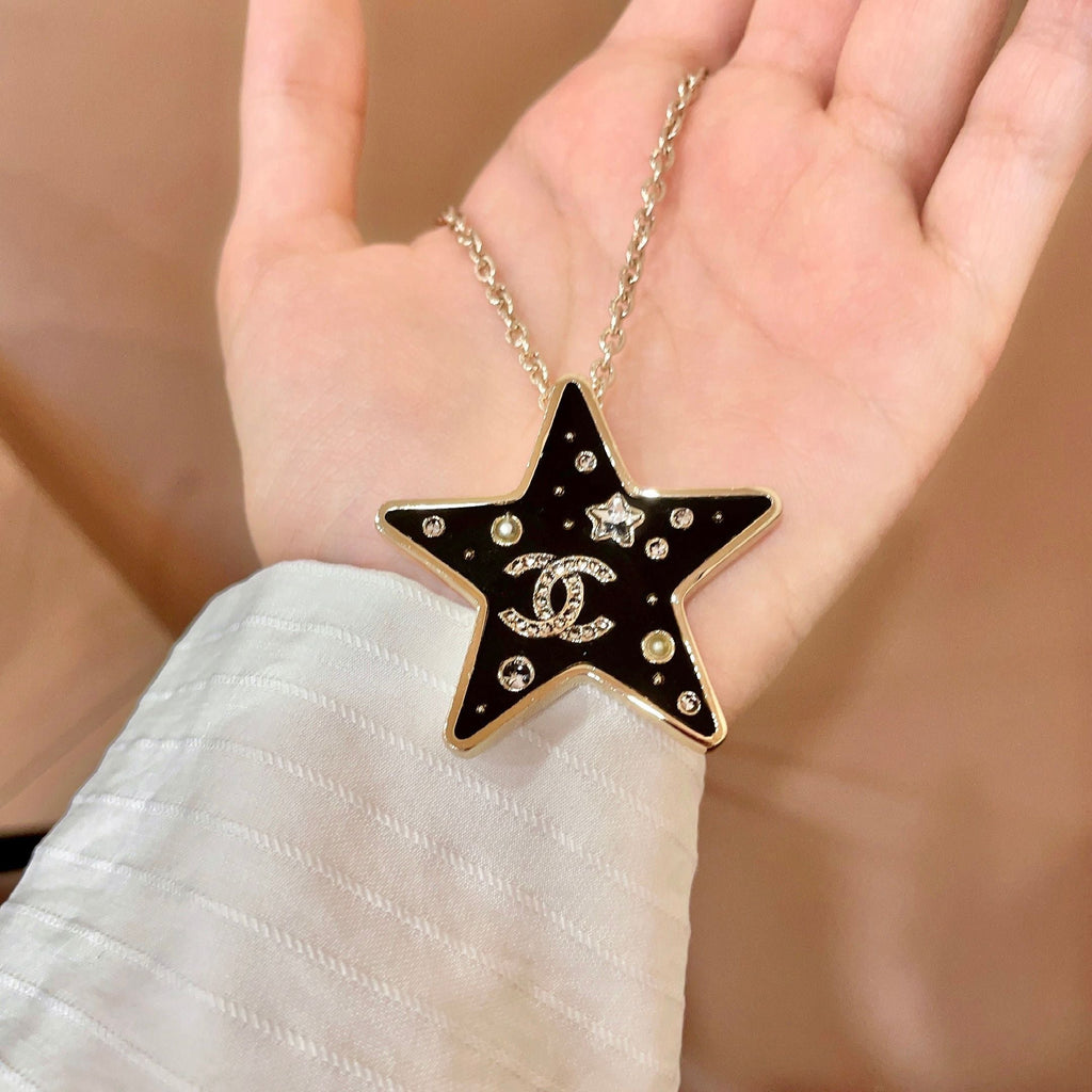 CHANEL 26S DOUBLE C LOGO BLACK ENAMEL STAR PENDANT NECKLACE WITH CRYSTAL DETAIL IN GOLD METAL 631015