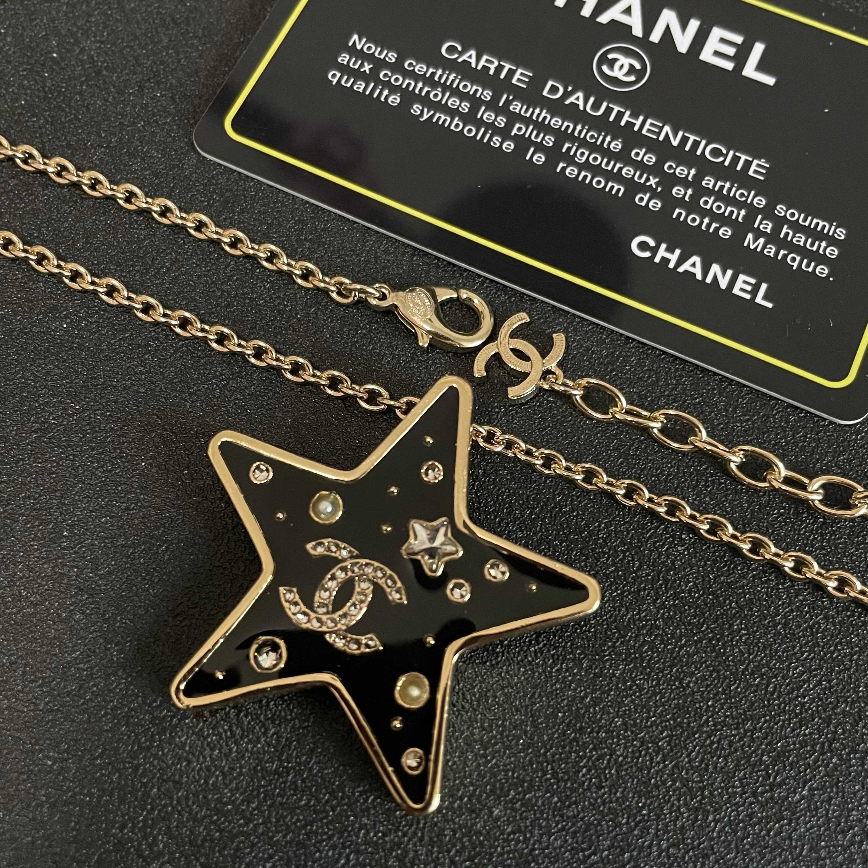 CHANEL 26S DOUBLE C LOGO BLACK ENAMEL STAR PENDANT NECKLACE WITH CRYSTAL DETAIL IN GOLD METAL 631015