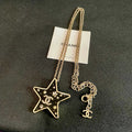 CHANEL 26S DOUBLE C LOGO BLACK ENAMEL STAR PENDANT NECKLACE WITH CRYSTAL DETAIL IN GOLD METAL 631015