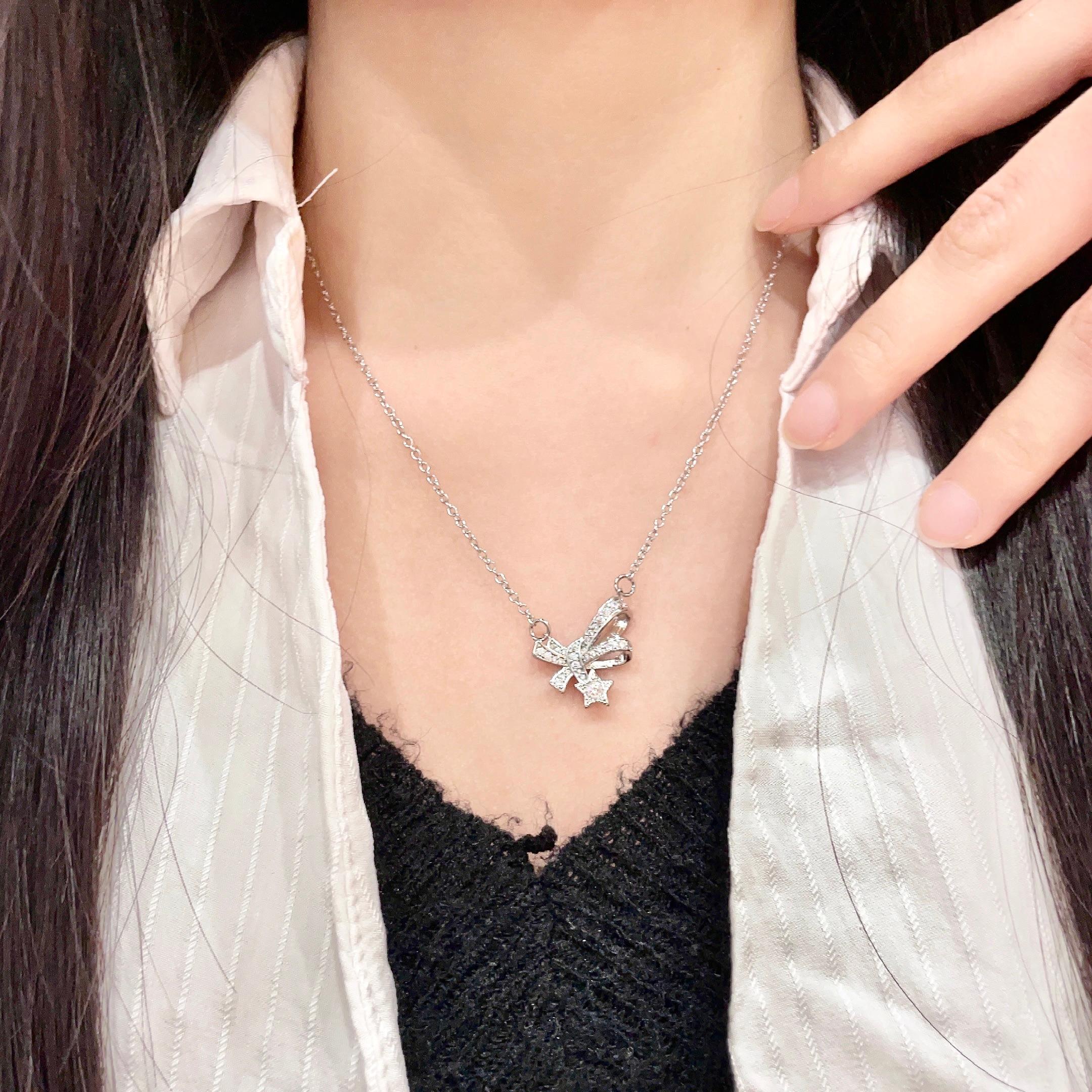 CHANEL 26S DOUBLE C LOGO CRYSTAL BOW & STAR PENDANT NECKLACE IN SILVER METAL 631019