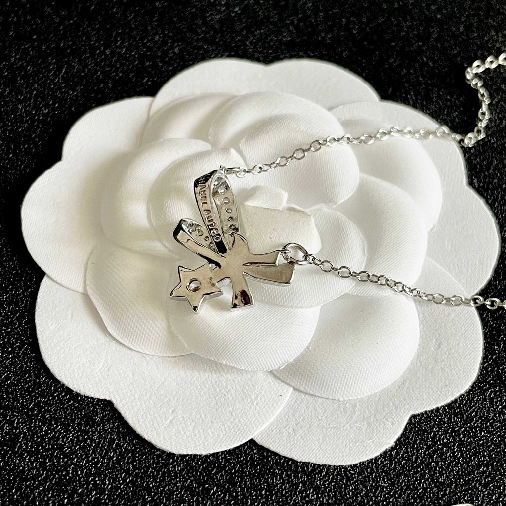 CHANEL 26S DOUBLE C LOGO CRYSTAL BOW & STAR PENDANT NECKLACE IN SILVER METAL 631019