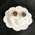 CHANEL 26S DOUBLE C LOGO PEARL TRIM ROUND STUD EARRINGS IN SILVER METAL 631020