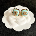 CHANEL 26S DOUBLE C LOGO MINT ENAMEL SQUARE STUD EARRINGS WITH CRYSTAL DETAIL IN GOLD METAL 631028