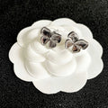 CHANEL 26S FOUR PETAL FLOWER STUD EARRINGS IN SILVER METAL 631032