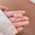 CHANEL 26S DOUBLE C LOGO PEARL WHITE ENAMEL SQUARE STUD EARRINGS IN GOLD METAL 631035
