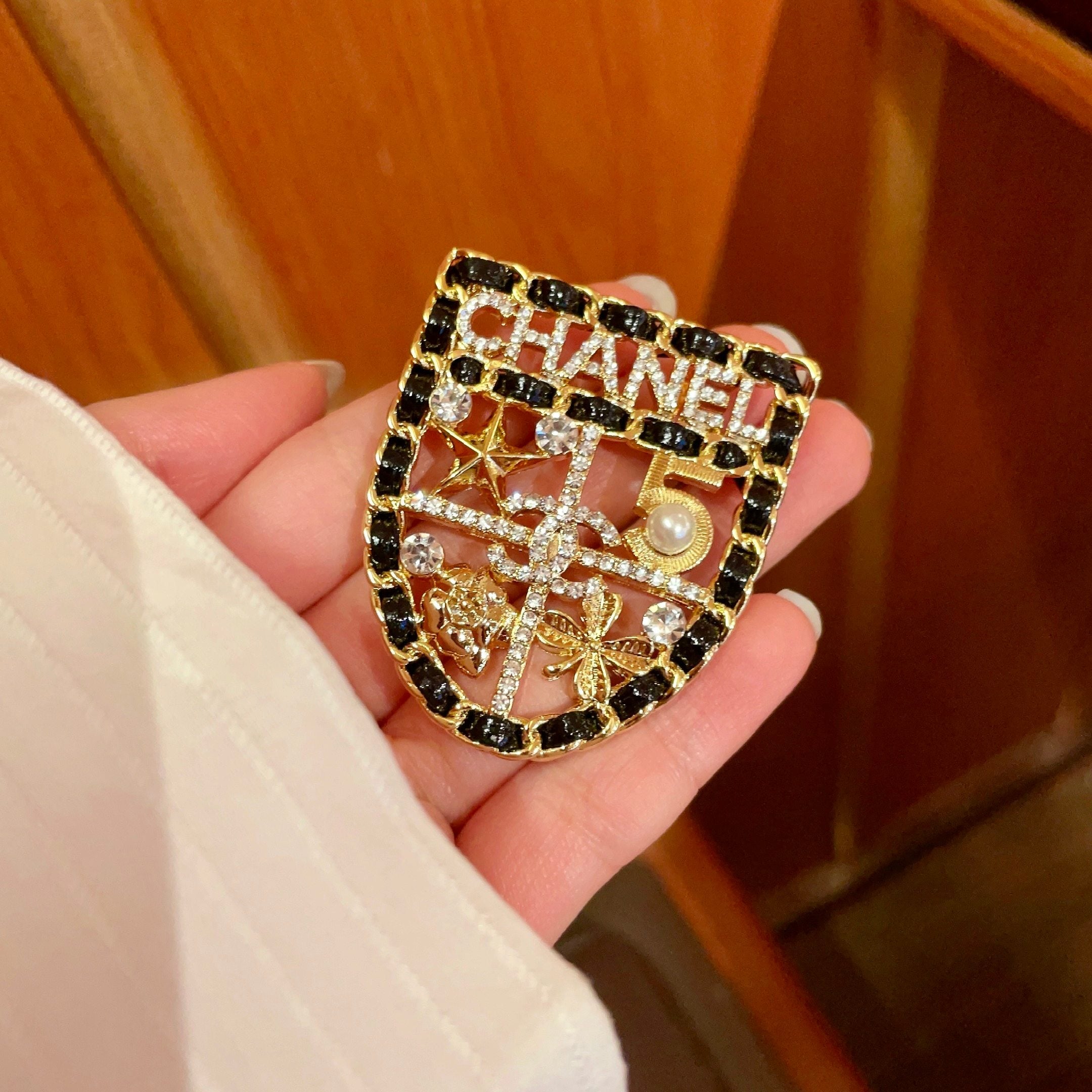 CHANEL 26S NUMBER SHIELD BROOCH WITH MULTI-CRYSTAL DETAIL IN GOLD METAL 631042
