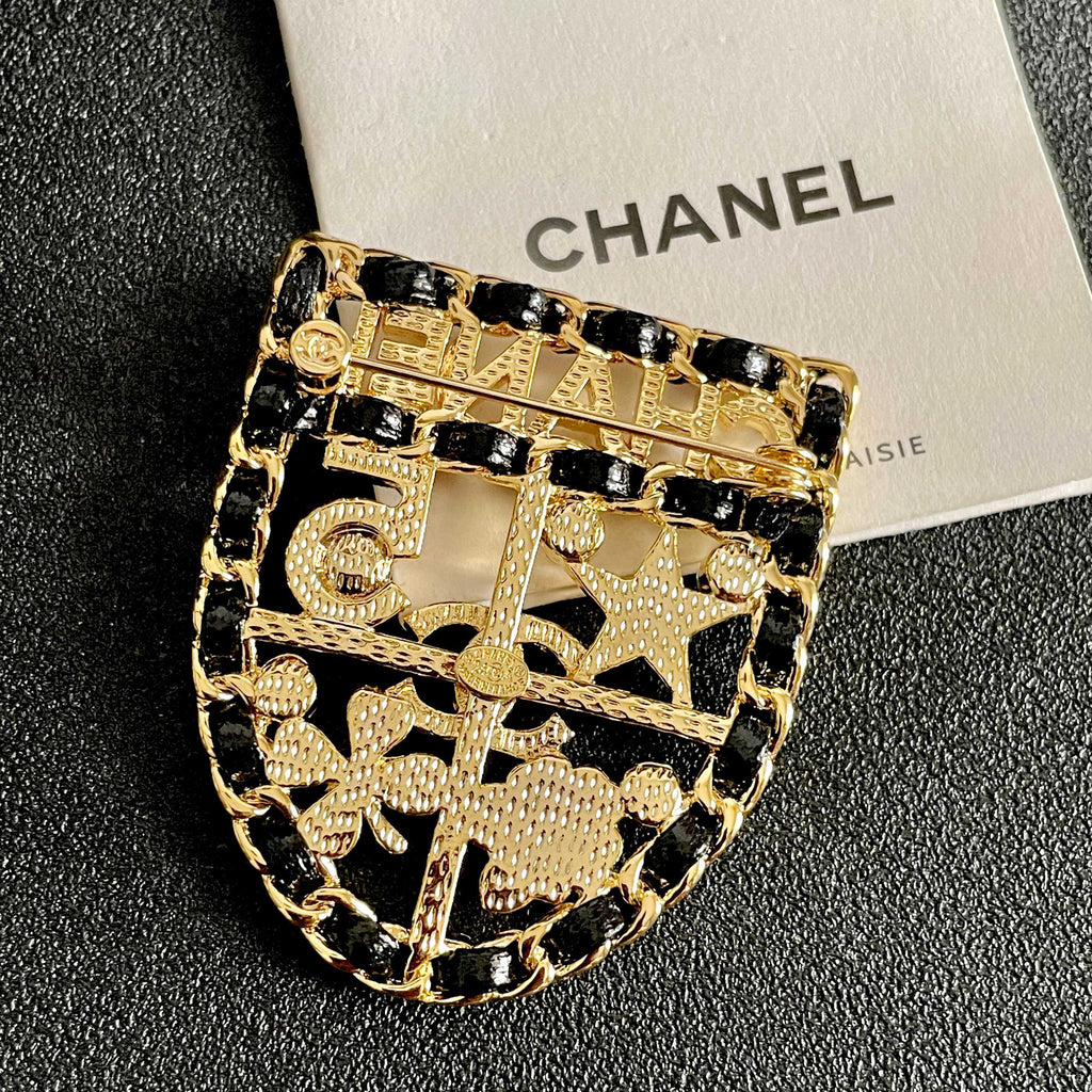 CHANEL 26S NUMBER SHIELD BROOCH WITH MULTI-CRYSTAL DETAIL IN GOLD METAL 631042