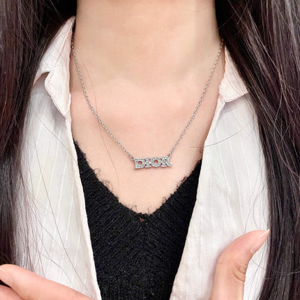 CD 26S PAVE LOGO LETTER NECKLACE IN SILVER TONE METAL 631805