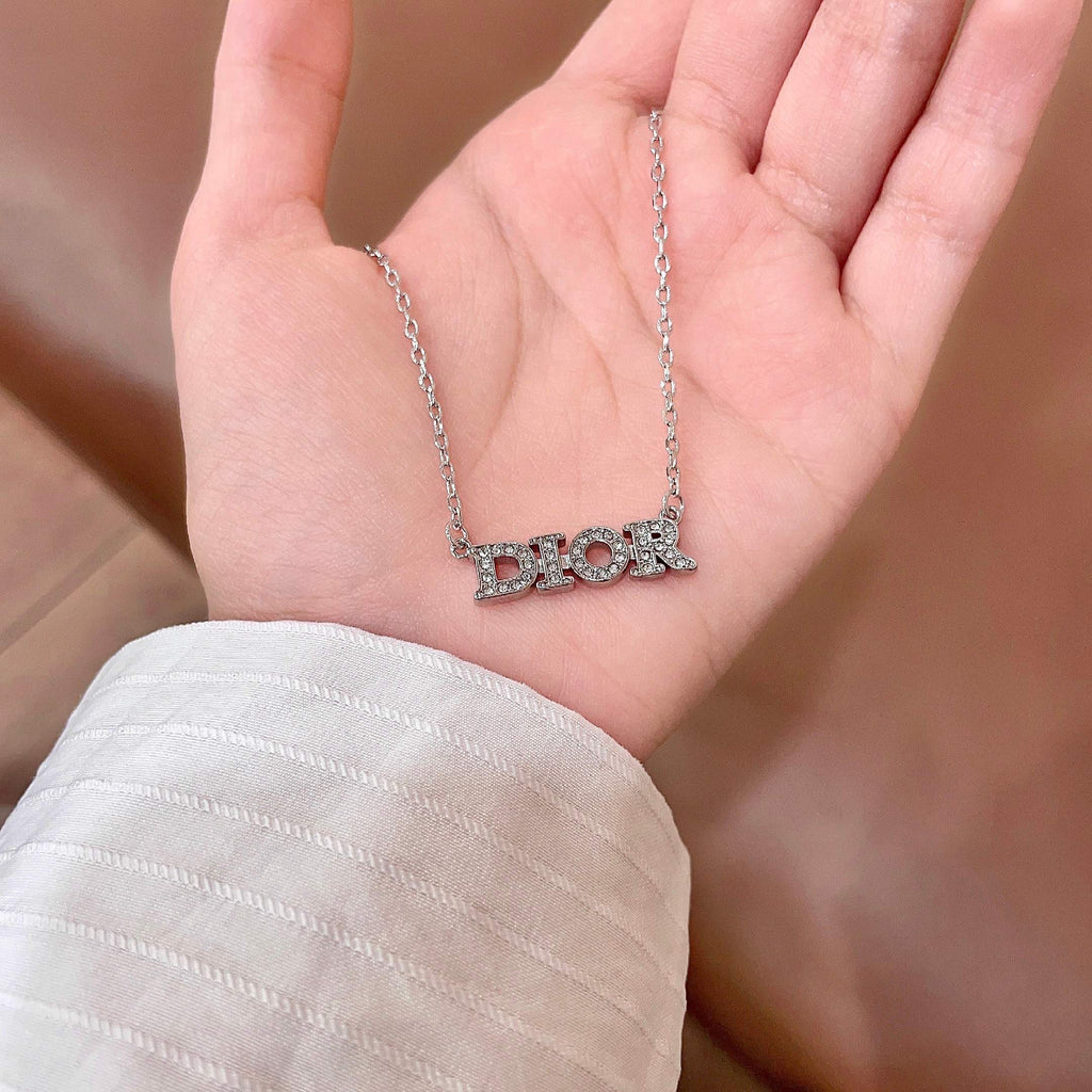 CD 26S PAVE LOGO LETTER NECKLACE IN SILVER TONE METAL 631805