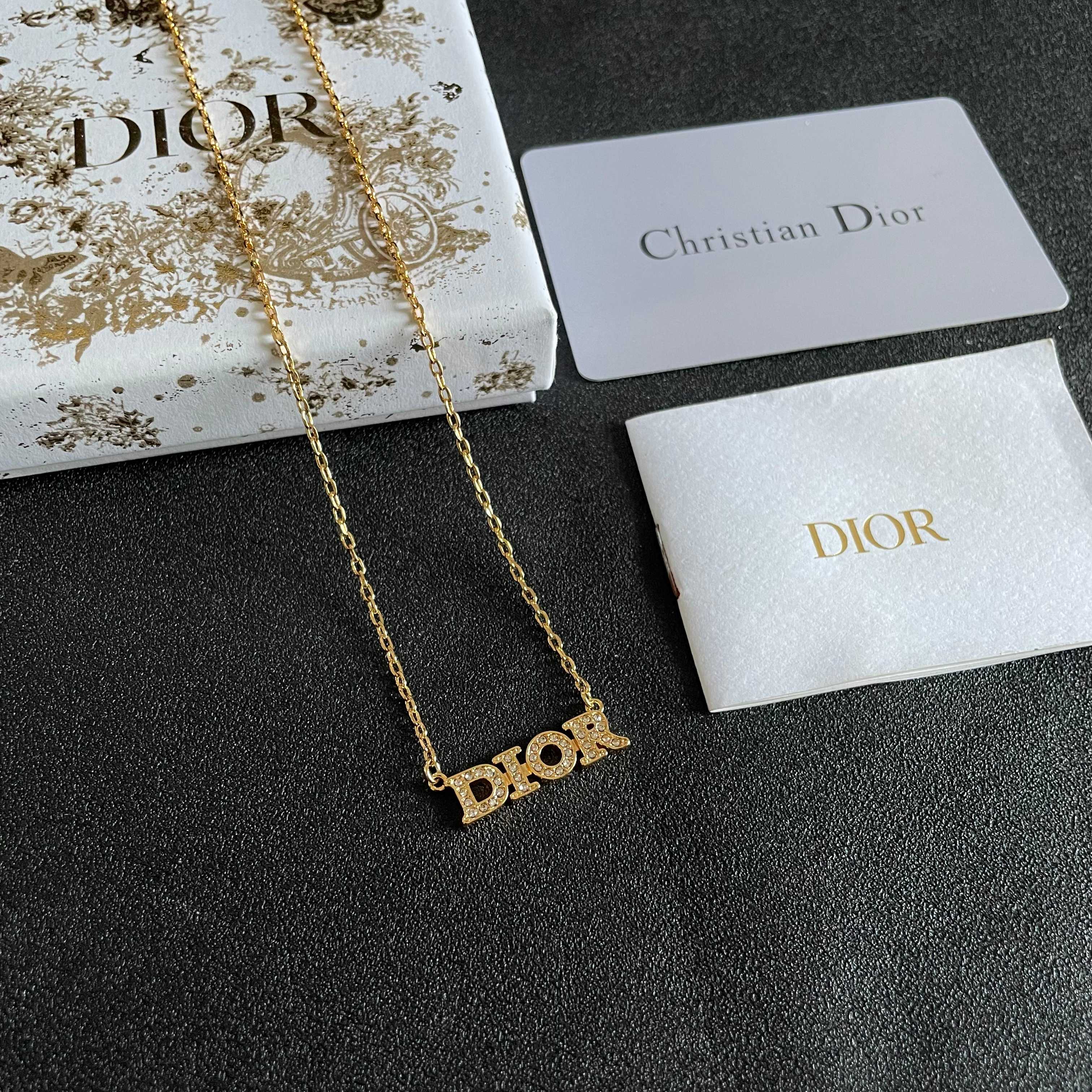 CD 26S PAVE LOGO LETTER NECKLACE IN GOLD TONE METAL 631806