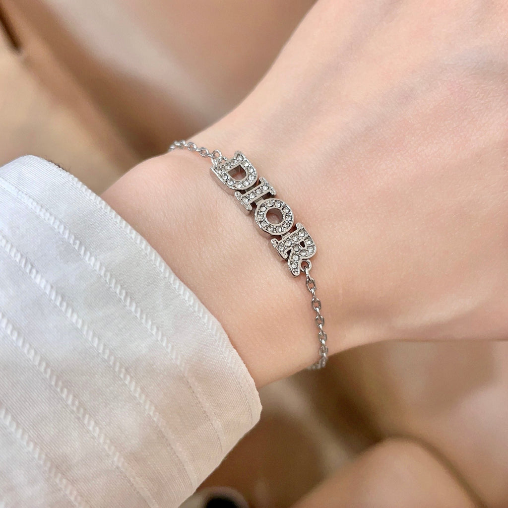 CD 26S PAVE LOGO LETTER BRACELET IN SILVER TONE METAL 631807