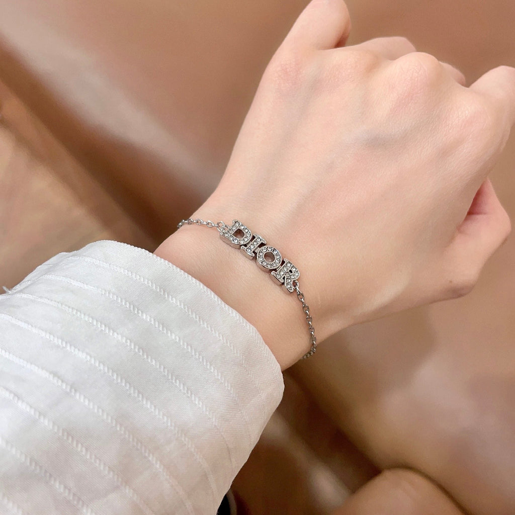 CD 26S PAVE LOGO LETTER BRACELET IN SILVER TONE METAL 631807