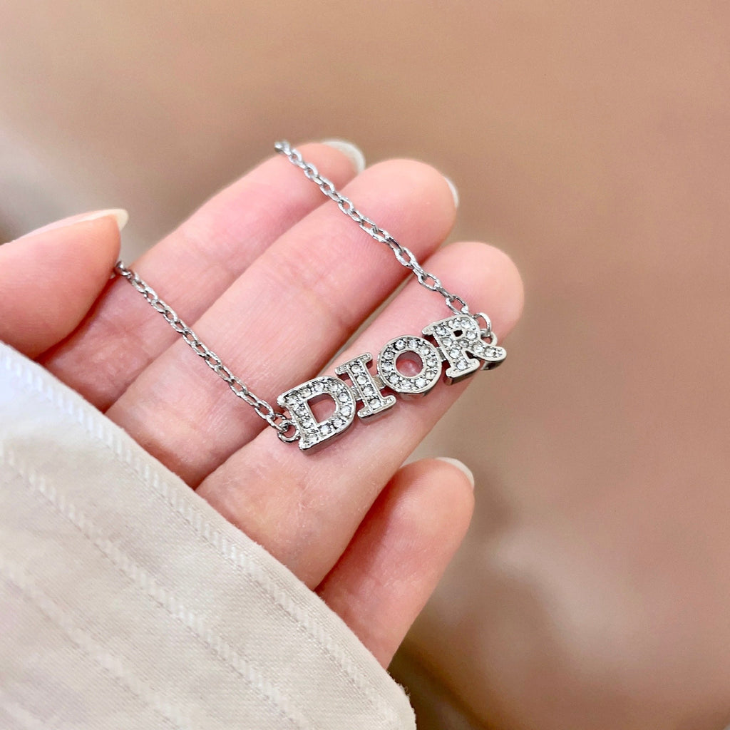 CD 26S PAVE LOGO LETTER BRACELET IN SILVER TONE METAL 631807
