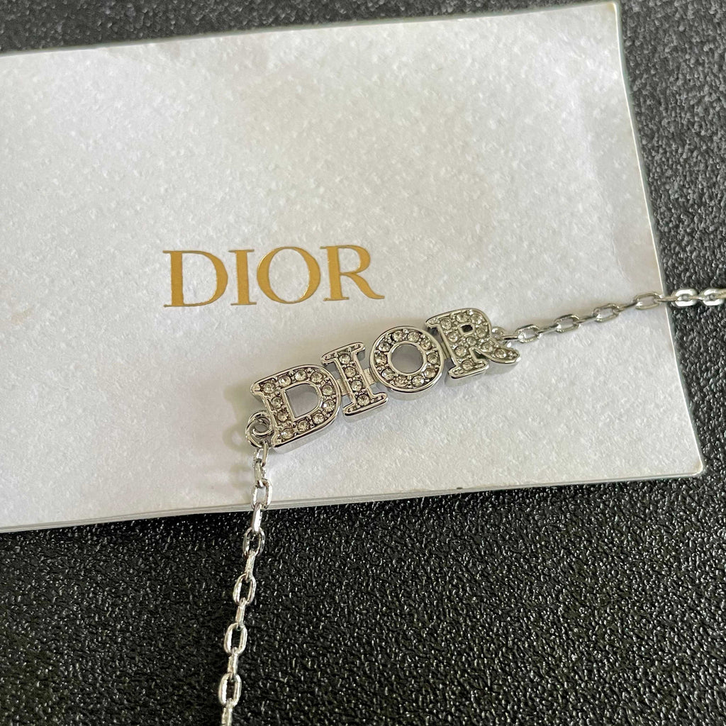 CD 26S PAVE LOGO LETTER BRACELET IN SILVER TONE METAL 631807