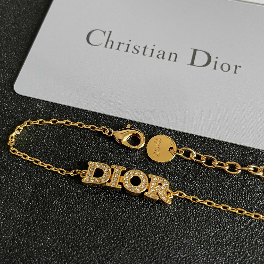 CD 26S PAVE LOGO LETTER BRACELET IN GOLD TONE METAL 631808