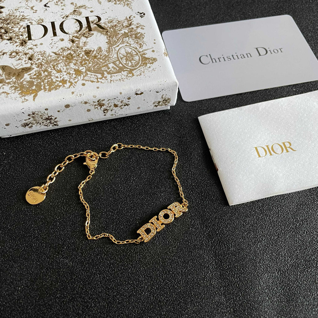 CD 26S PAVE LOGO LETTER BRACELET IN GOLD TONE METAL 631808