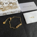 CD 26S PAVE LOGO LETTER BRACELET IN GOLD TONE METAL 631808