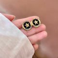 CD 26S STAR MEDALLION LOGO STUD EARRINGS IN BLACK ENAMEL & GOLD TONE METAL 631813