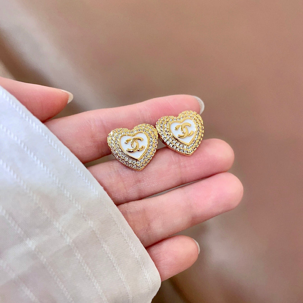 CHANEL 26S DOUBLE C LOGO PAVE HEART STUD EARRINGS WITH WHITE ENAMEL IN GOLD METAL 631815