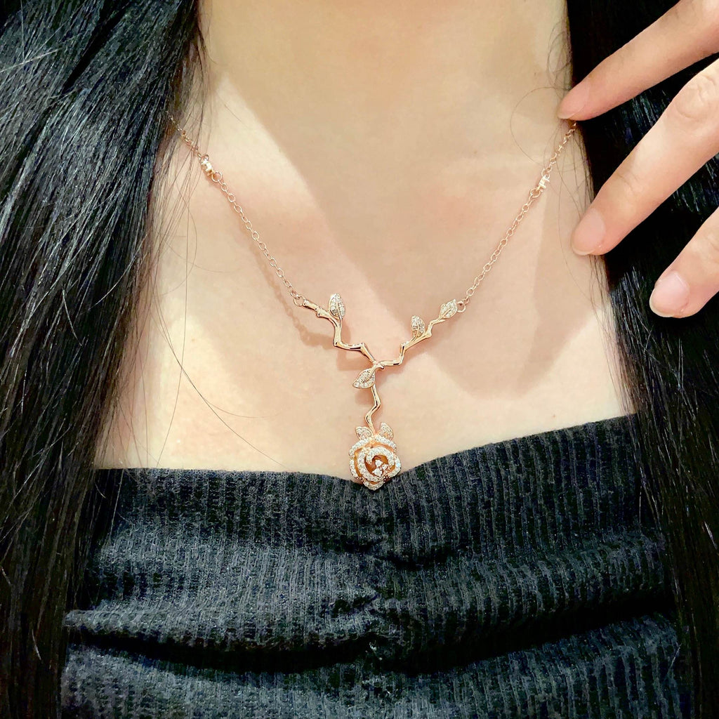 CD 26S CRYSTAL ROSE BRANCH PENDANT NECKLACE IN ROSE GOLD TONE METAL 631896