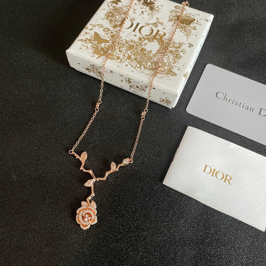CD 26S CRYSTAL ROSE BRANCH PENDANT NECKLACE IN ROSE GOLD TONE METAL 631896