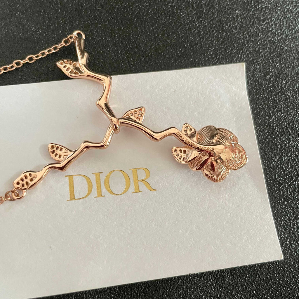 CD 26S CRYSTAL ROSE BRANCH PENDANT NECKLACE IN ROSE GOLD TONE METAL 631896