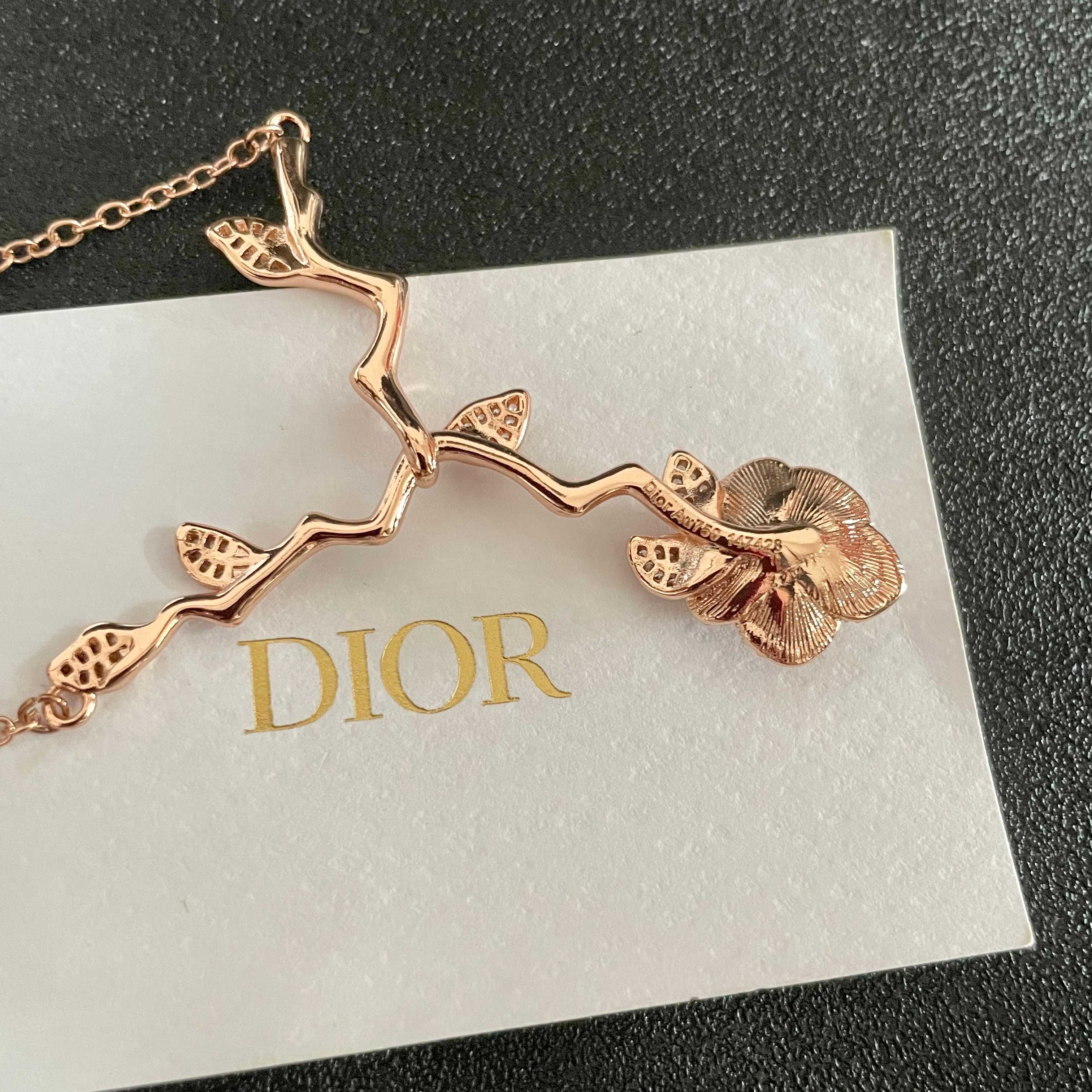 CD 26S CRYSTAL ROSE BRANCH PENDANT NECKLACE IN ROSE GOLD TONE METAL 631896