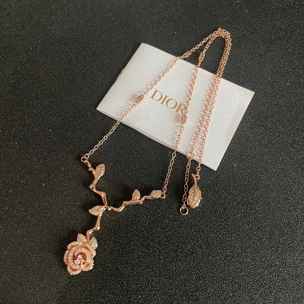 CD 26S CRYSTAL ROSE BRANCH PENDANT NECKLACE IN ROSE GOLD TONE METAL 631896
