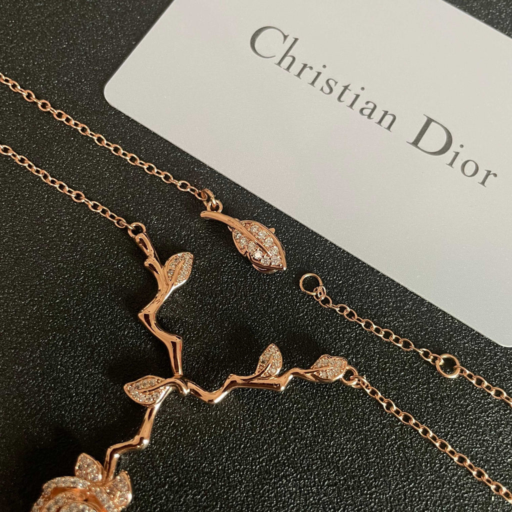 CD 26S CRYSTAL ROSE BRANCH PENDANT NECKLACE IN ROSE GOLD TONE METAL 631896