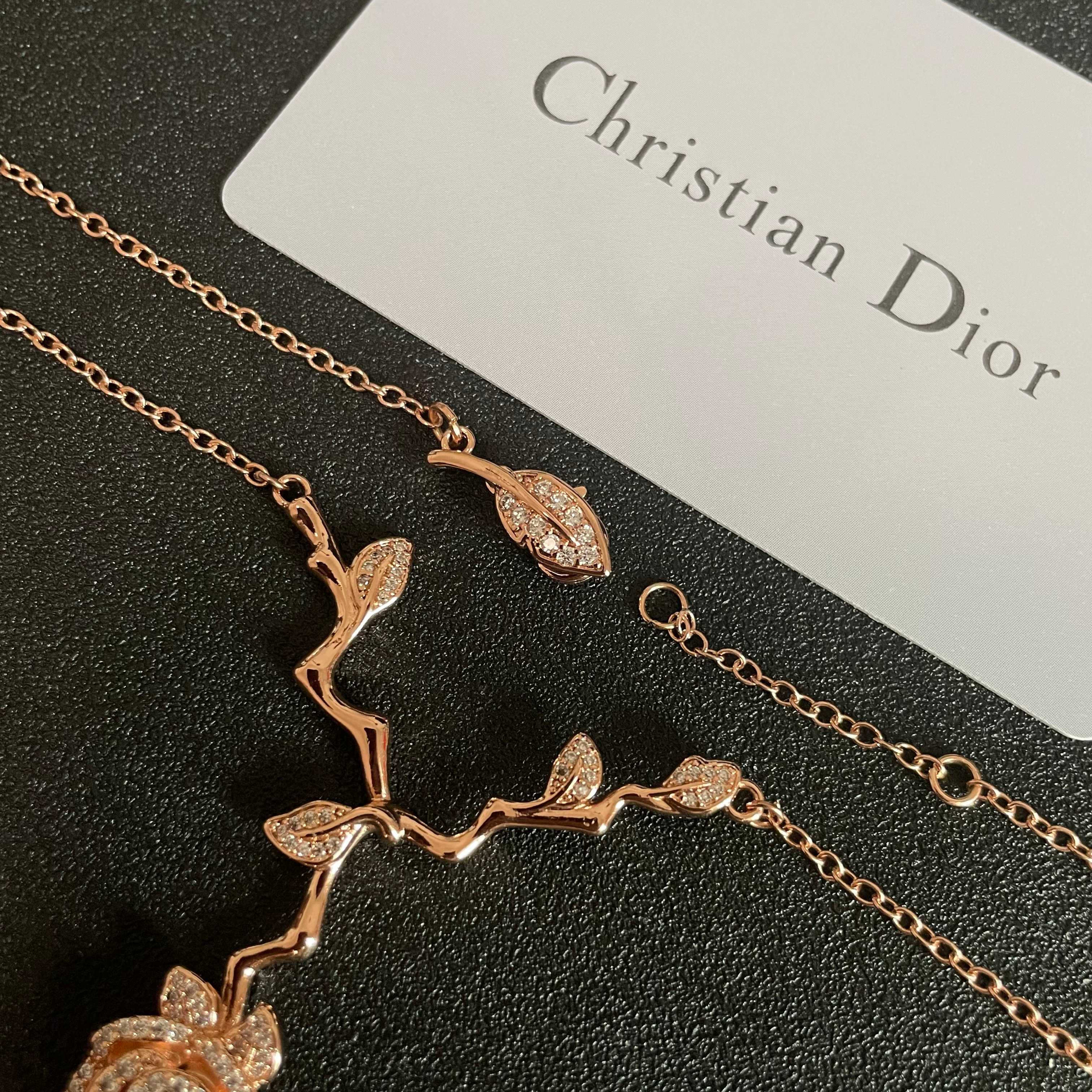 CD 26S CRYSTAL ROSE BRANCH PENDANT NECKLACE IN ROSE GOLD TONE METAL 631896