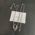 CD 26S CRYSTAL DIOR LOGO PENDANT NECKLACE IN SILVER METAL 631900