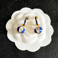 CHANEL 26S DOUBLE C LOGO BALL DROP EARRINGS IN BLUE AND WHITE ENAMEL WITH GOLD METAL 631905