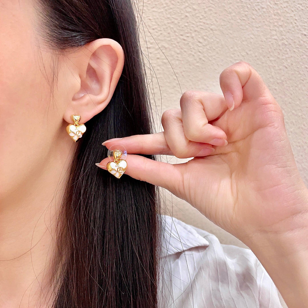 CHANEL 26S DOUBLE C HEART DROP EARRINGS WITH WHITE ENAMEL FLORAL DETAIL IN GOLD METAL 631910