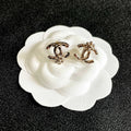 CHANEL 26S DOUBLE C LOGO PEARL STUD EARRINGS WITH FLORAL DETAIL IN GOLD METAL 631917