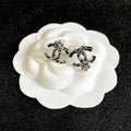 CHANEL 26S DOUBLE C LOGO PEARL STUD EARRINGS WITH FLORAL DETAIL IN SILVER METAL 631916