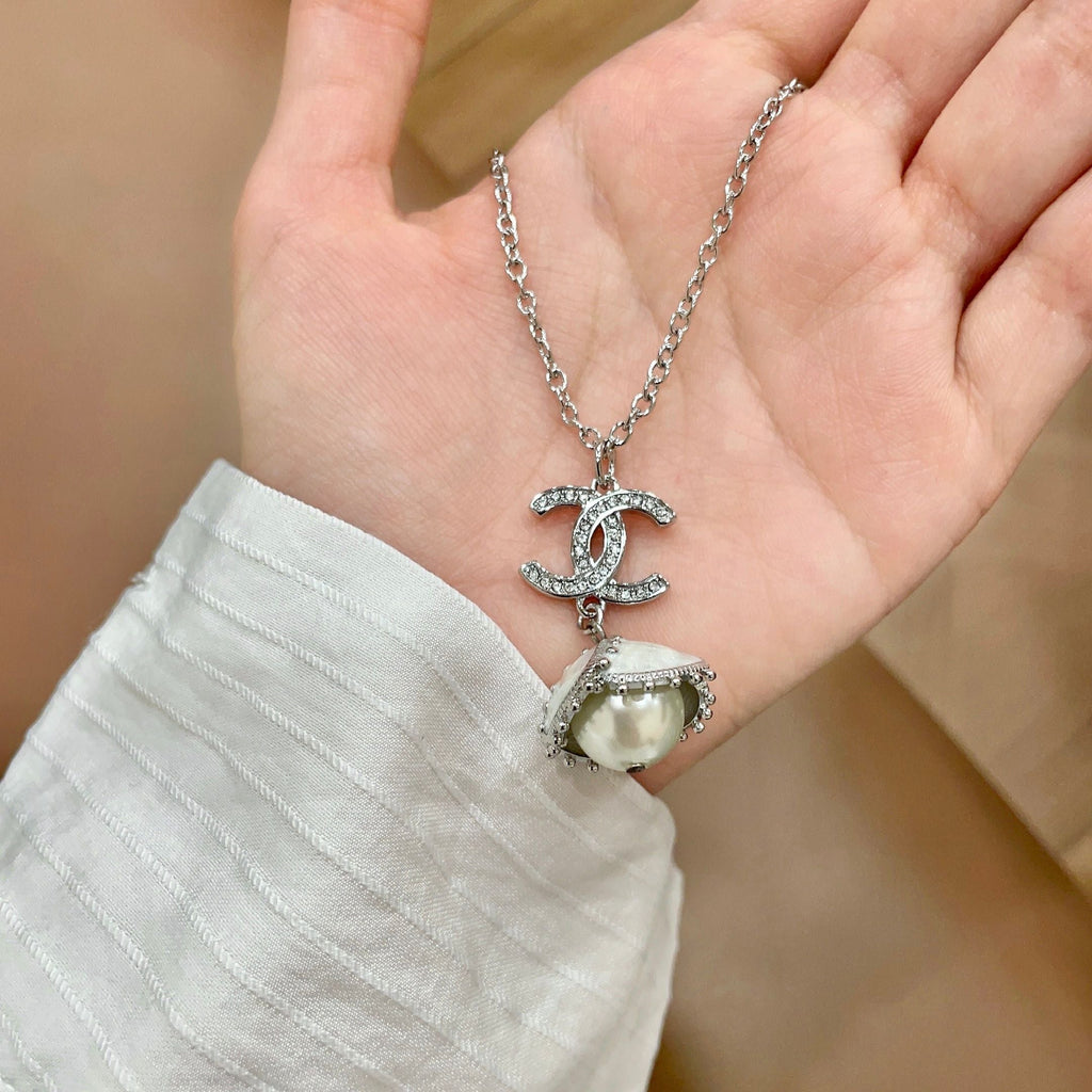 CHANEL 26S DOUBLE C LOGO PEARL DROP PENDANT NECKLACE WITH CRYSTAL HALO IN SILVER METAL 633293