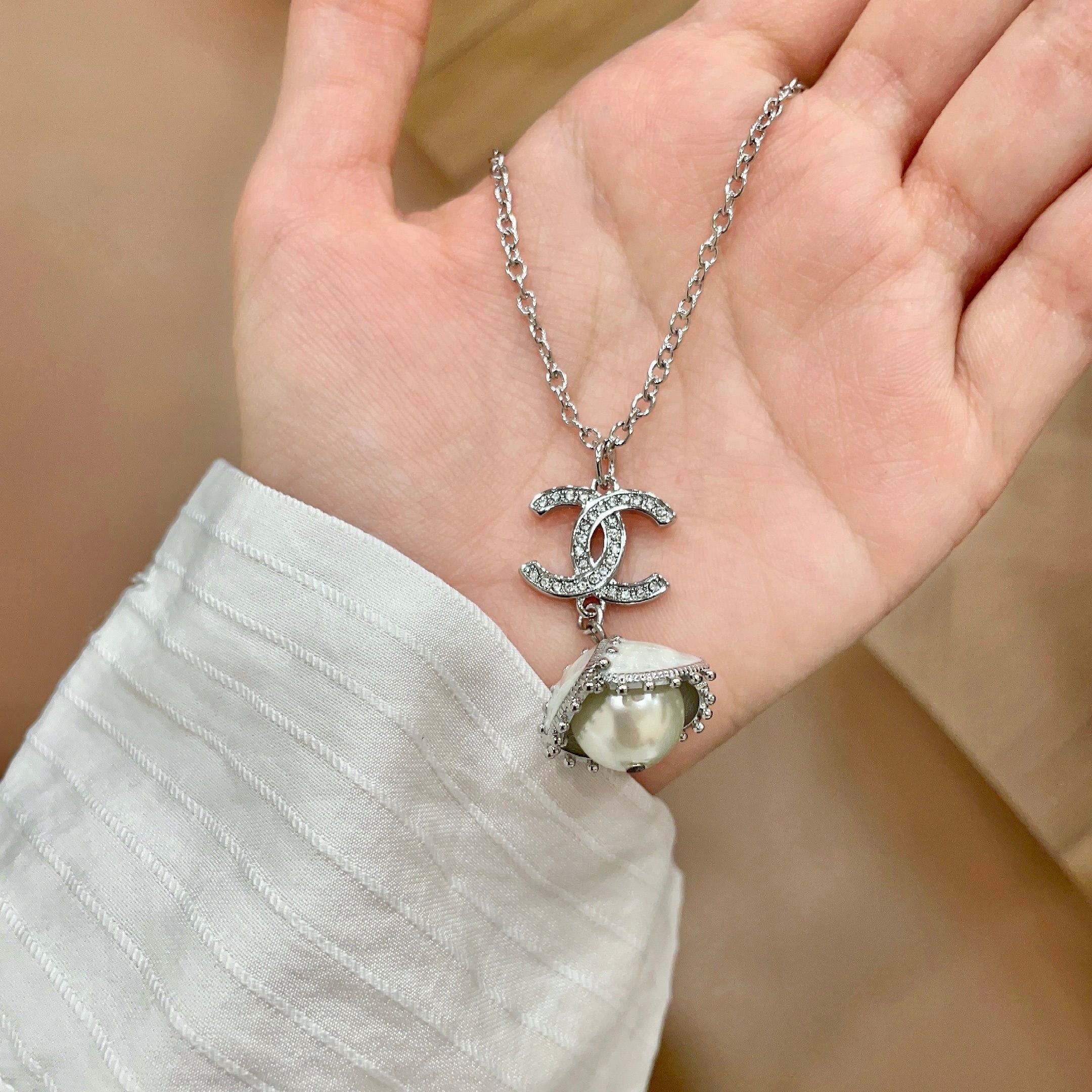CHANEL 26S DOUBLE C LOGO PEARL DROP PENDANT NECKLACE WITH CRYSTAL HALO IN SILVER METAL 633293