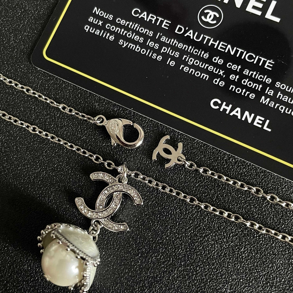 CHANEL 26S DOUBLE C LOGO PEARL DROP PENDANT NECKLACE WITH CRYSTAL HALO IN SILVER METAL 633293