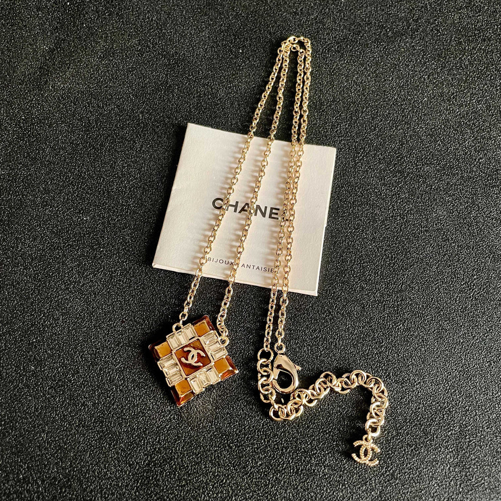 CHANEL 26S DOUBLE C LOGO AMBER CRYSTAL SQUARE PENDANT NECKLACE IN GOLD METAL 633294