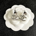 CHANEL 26S CHANEL CC LOGO WOVEN METAL DROP EARRINGS WITH CRYSTAL STUD IN SILVER METAL 633303