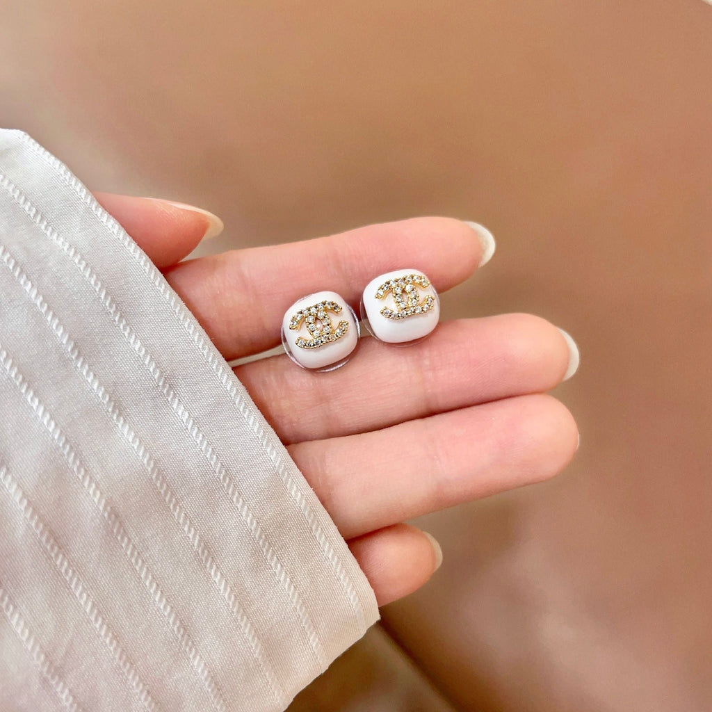 CHANEL 26S CHANEL CC LOGO PAVE CRYSTAL STUD EARRINGS IN WHITE ENAMEL WITH GOLD METAL 633309