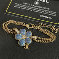 CHANEL 26S DOUBLE C LOGO BLUE ENAMEL FLOWER CHAIN BRACELET WITH CRYSTAL DETAIL IN GOLD METAL 633154