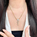 YSL 26S CRYSTAL HEART LOGO PENDANT NECKLACE IN GOLD TONE METAL 633939