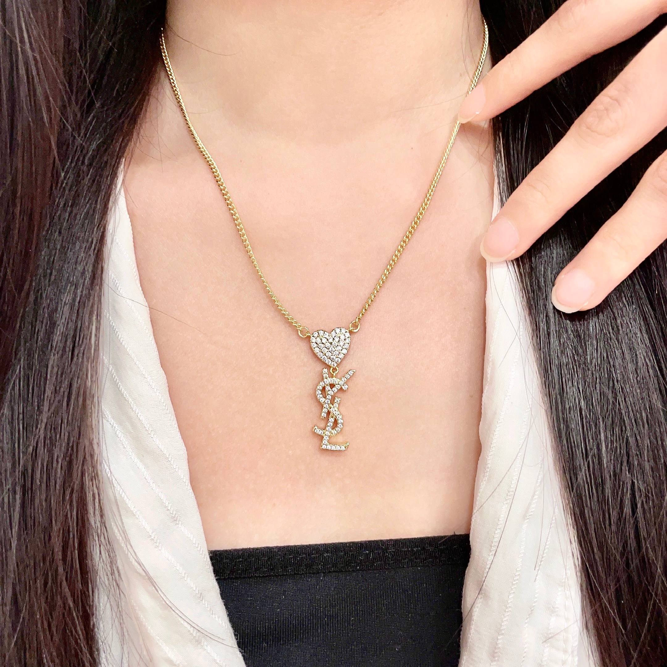 YSL 26S CRYSTAL HEART LOGO PENDANT NECKLACE IN GOLD TONE METAL 633939