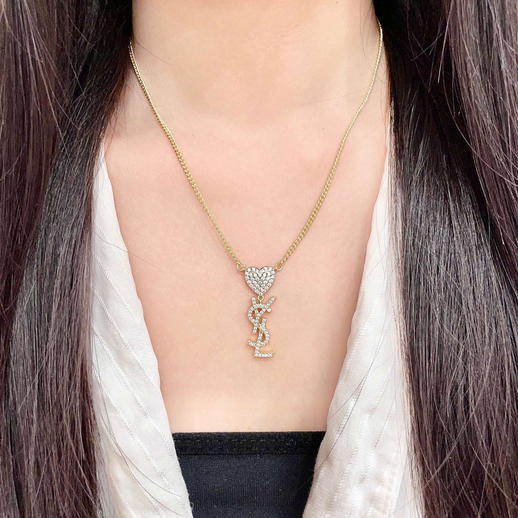 YSL 26S CRYSTAL HEART LOGO PENDANT NECKLACE IN GOLD TONE METAL 633939