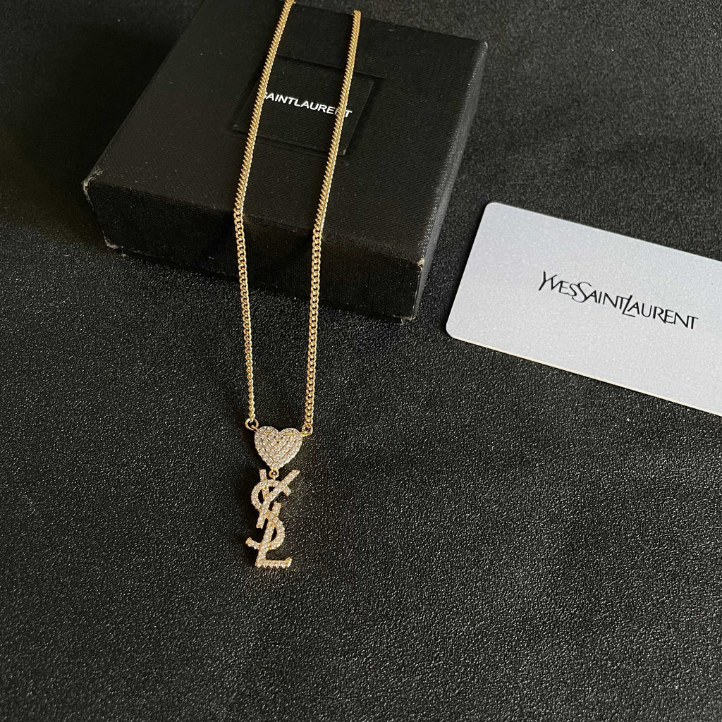 YSL 26S CRYSTAL HEART LOGO PENDANT NECKLACE IN GOLD TONE METAL 633939